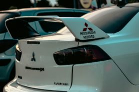 Close-up of a white Evolution X, rear view