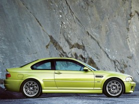 Yellow-gold BMW M3 Coupe parked outside