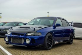 Blue Evo parked outside