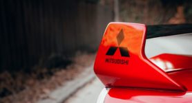 Wing of car with Mitsubishi branding