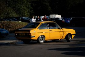 Yellow Ford Escort RS2000 on the road