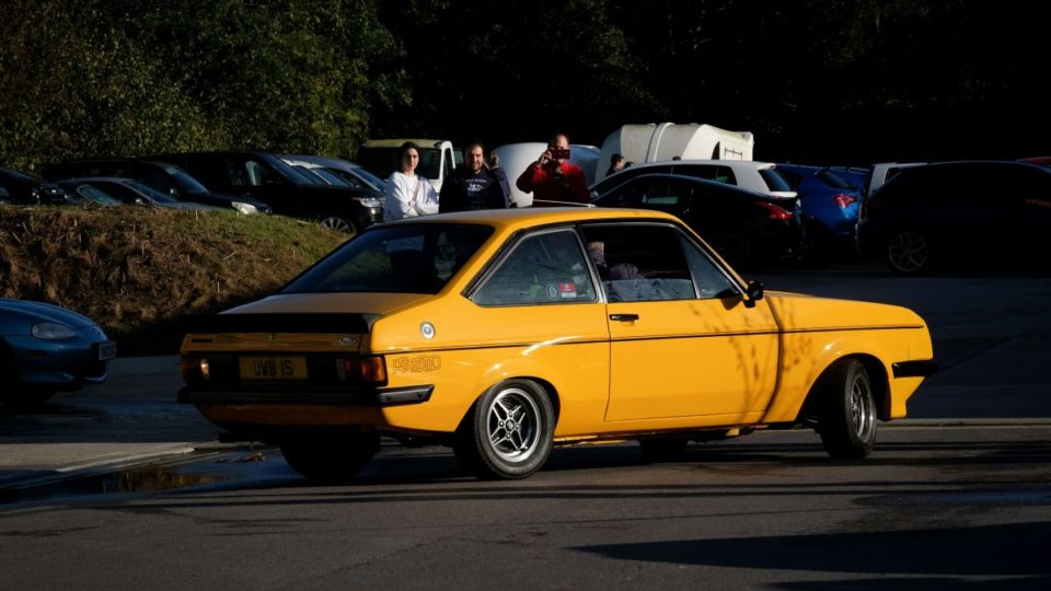Yellow Ford Escort RS2000 on the road