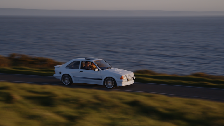 Cars that made the ‘80s – The Ford Escort driving along a road