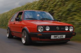 Cars that made the 80s the VW Golf Mk2 driving along a road