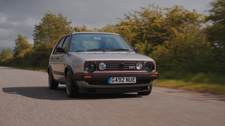 Cars that made the 80s the VW Golf Mk2 driving along a road