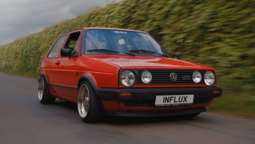 Cars that made the 80s the VW Golf Mk2 driving along a road